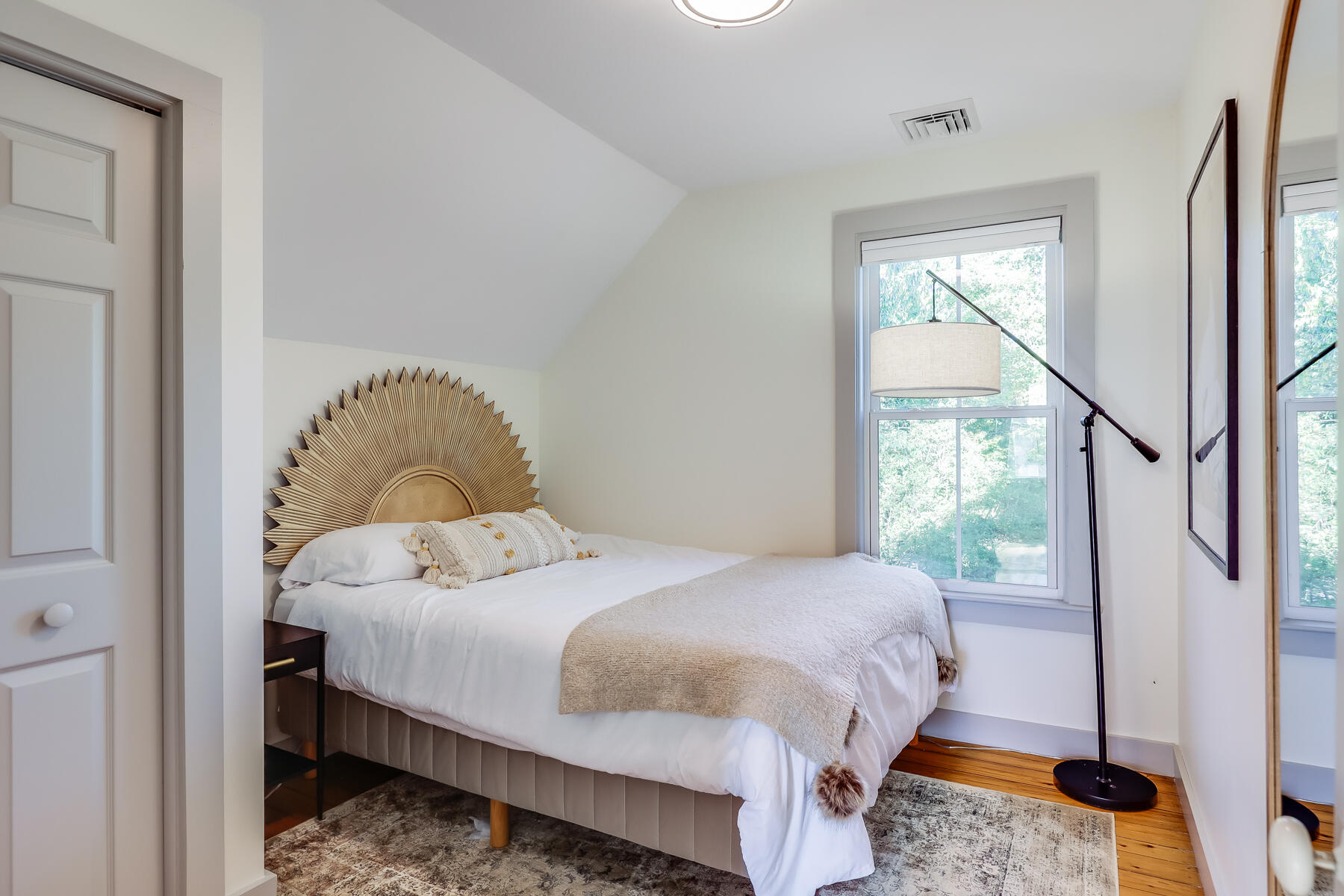 3 High Street Falmouth, MA 02543 - Photo 36 of 52 a bedroom with a bed and wooden floor