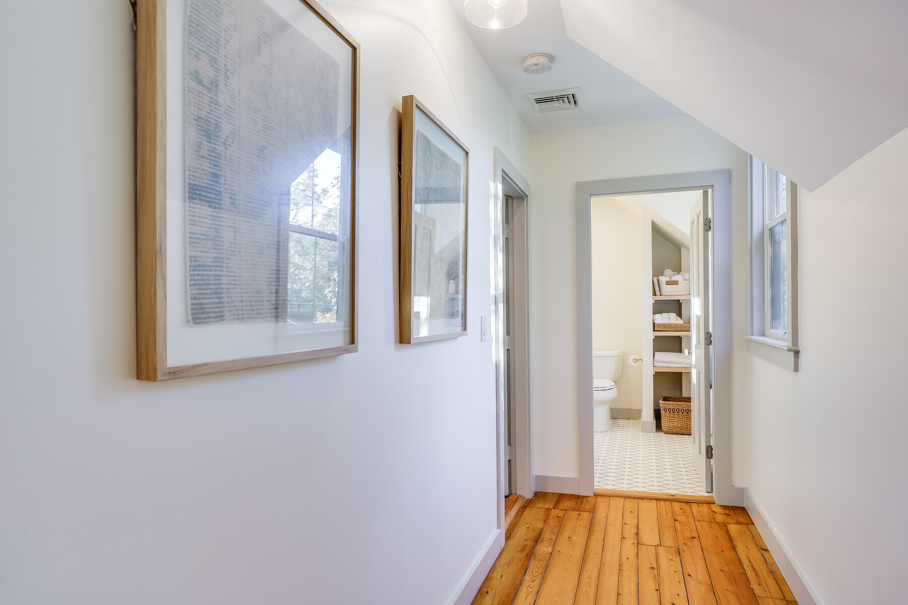 3 High Street Falmouth, MA 02543 - Photo 40 of 52 a view of a hallway with wooden floor and a bathroom