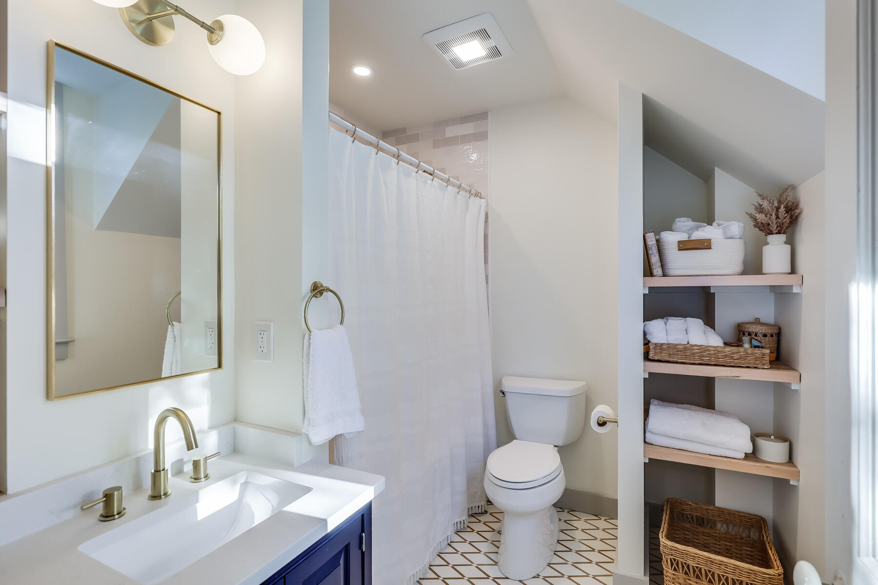 3 High Street Falmouth, MA 02543 - Photo 41 of 52 a bathroom with a toilet a sink and vanity