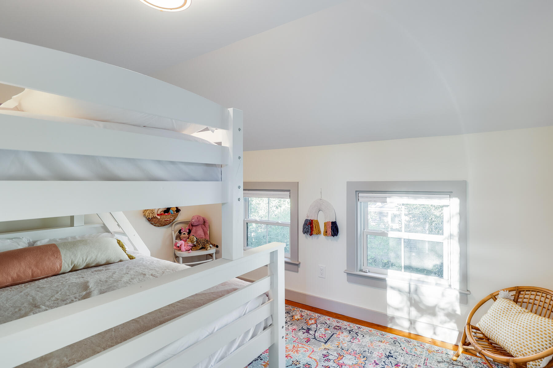 3 High Street Falmouth, MA 02543 - Photo 43 of 52 a bedroom with a bed and wooden floor