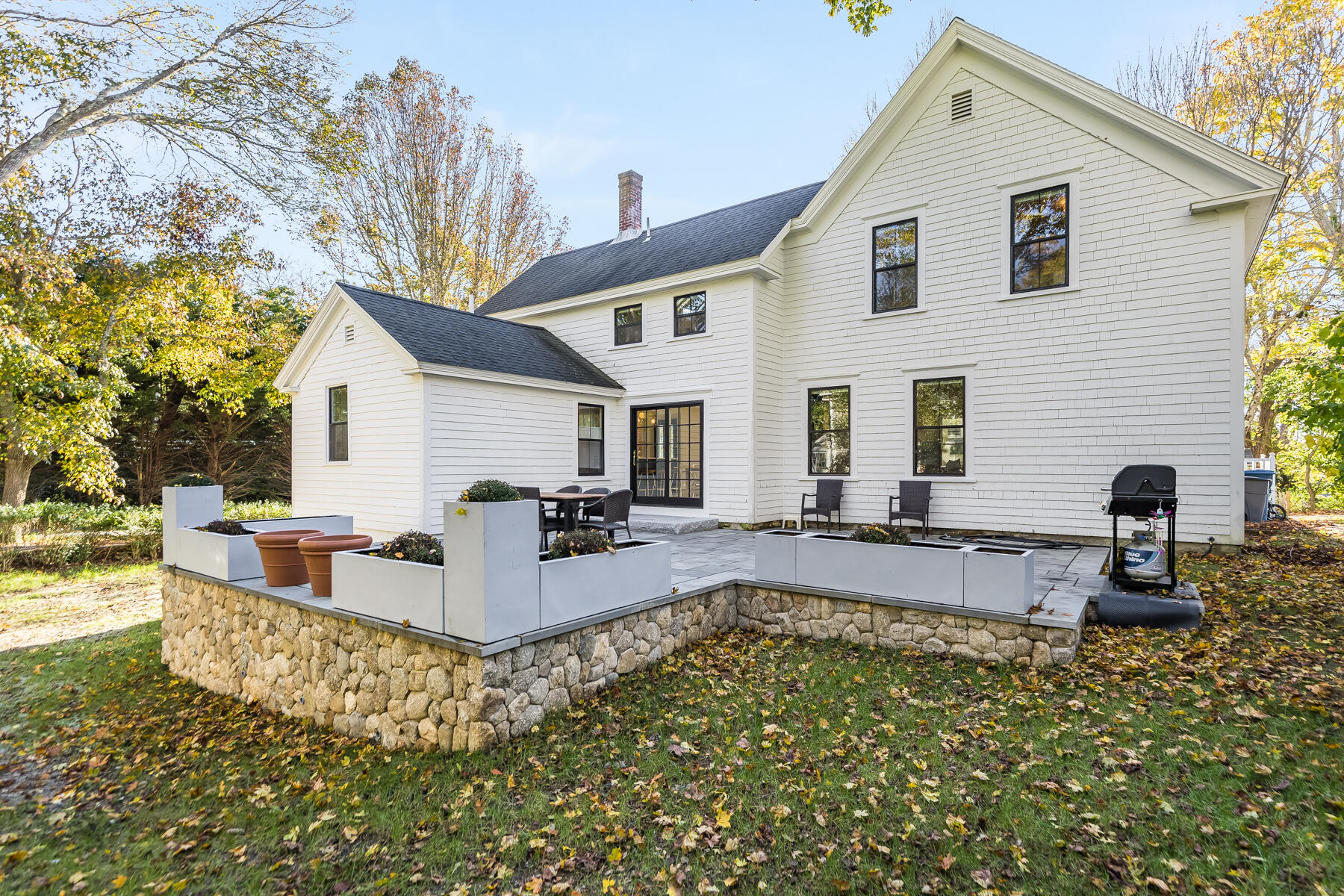 3 High Street Falmouth, MA 02543 - Photo 48 of 52 a view of a house with backyard and sitting area