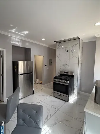 a kitchen with a refrigerator and a sink