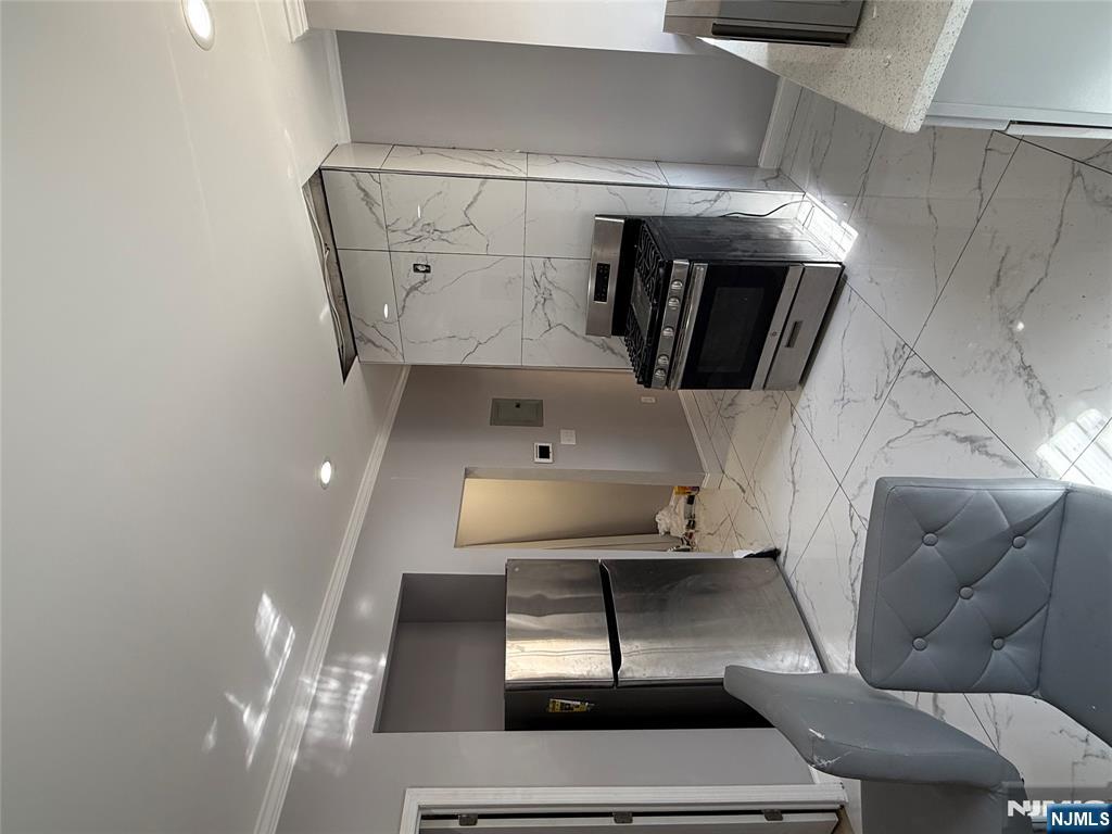 753 South 11th Street, Unit 1 Newark, NJ 07103 - Photo 11 of 17 a kitchen with a refrigerator and a sink