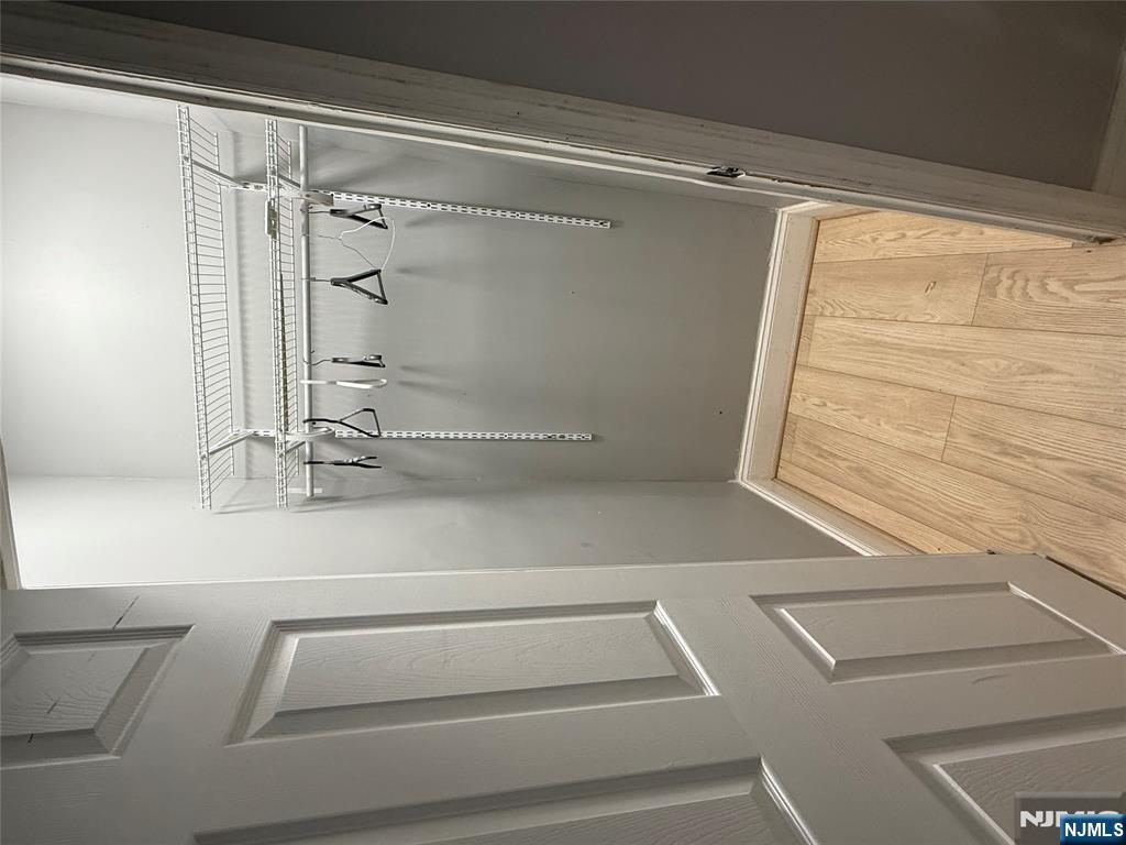 753 South 11th Street, Unit 1 Newark, NJ 07103 - Photo 16 of 17 a view of walk in closet with wooden floor