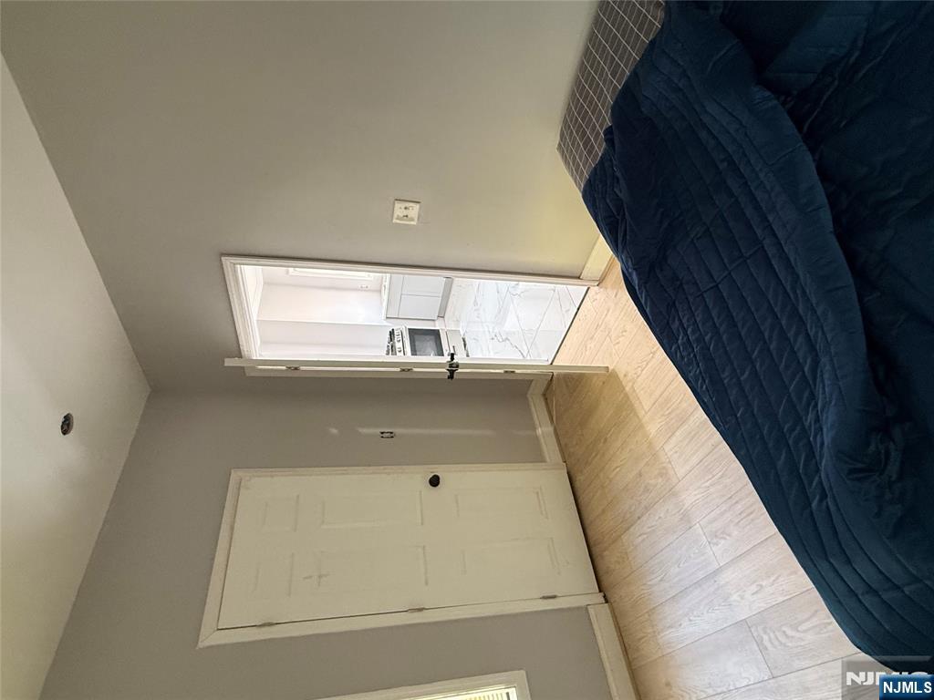 753 South 11th Street, Unit 1 Newark, NJ 07103 - Photo 17 of 17 a view of kitchen and hall with wooden floor
