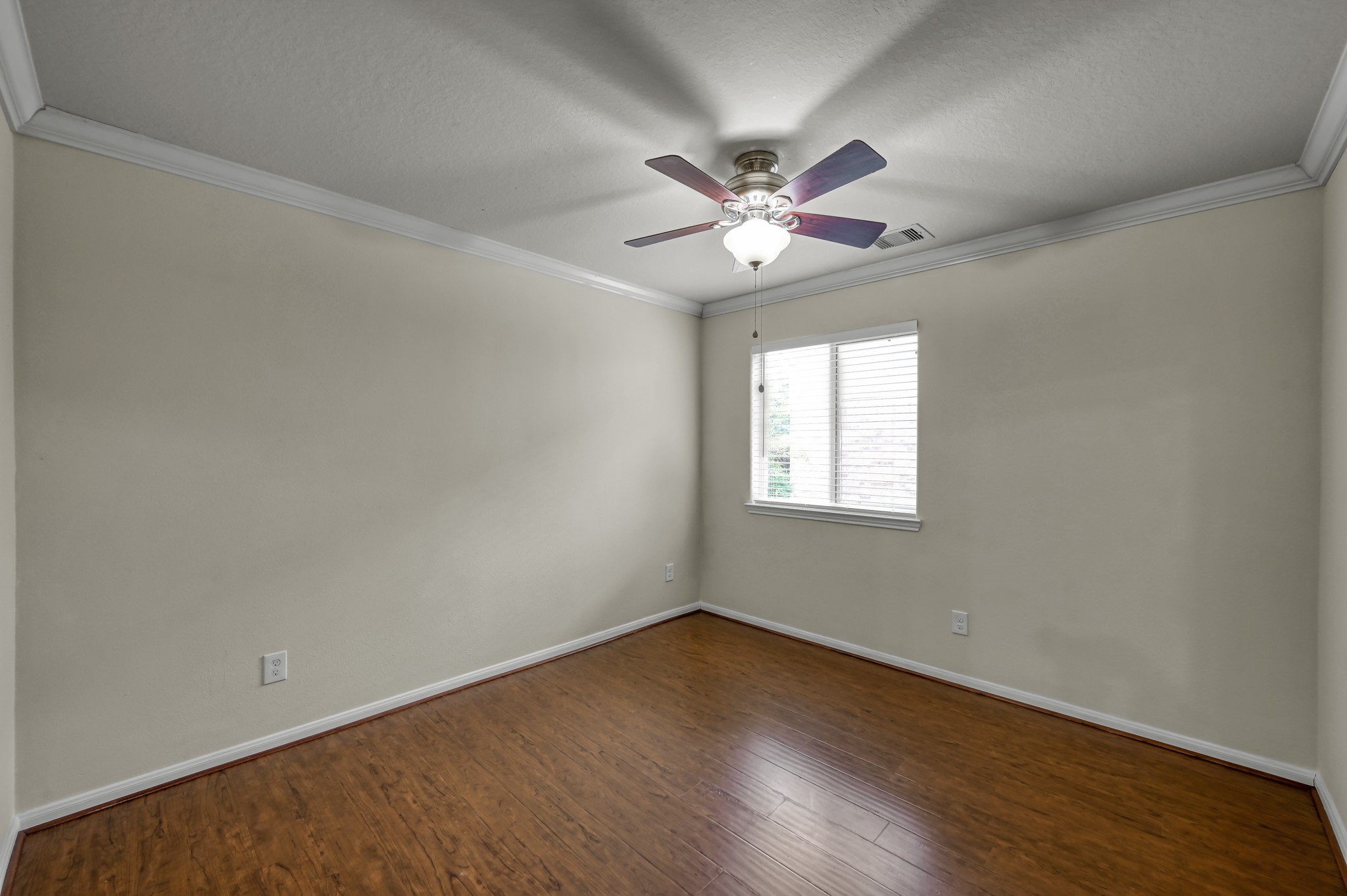631 Timberstand Lane Spring, TX 77373 - Photo 26 of 38 The secondary bedroom offers great natural light, upgraded laminate flooring, and plenty of space to make your own.