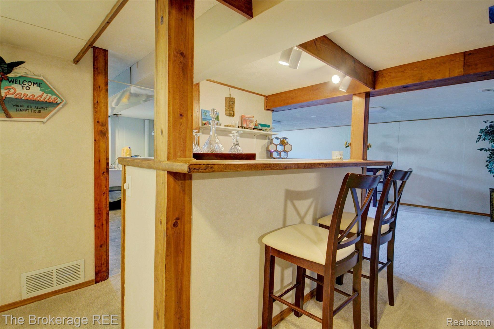 340 Thalia Avenue Rochester, MI 48307 - Photo 39 of 49 Finished basement with a bar
