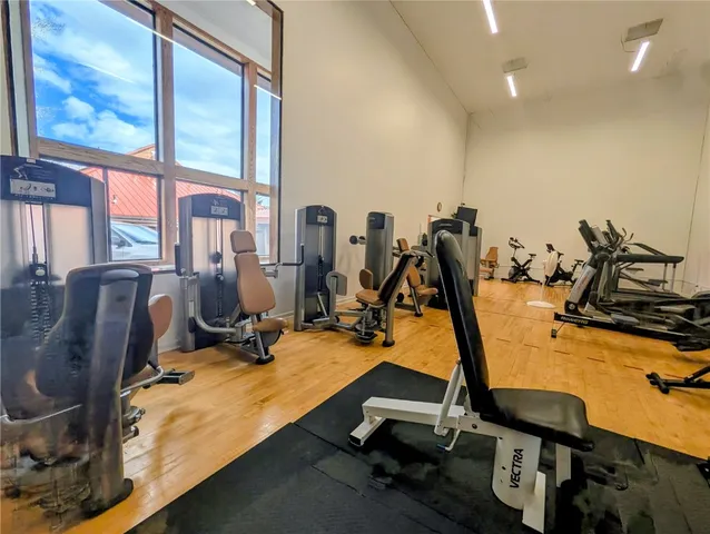 a view of a house with swimming pool and a yard