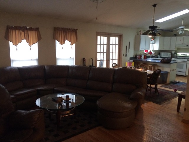 46 Bristol Ridge Road Bristol, IL 60512 - Photo 2 of 12 a living room with furniture a chandelier and a large window