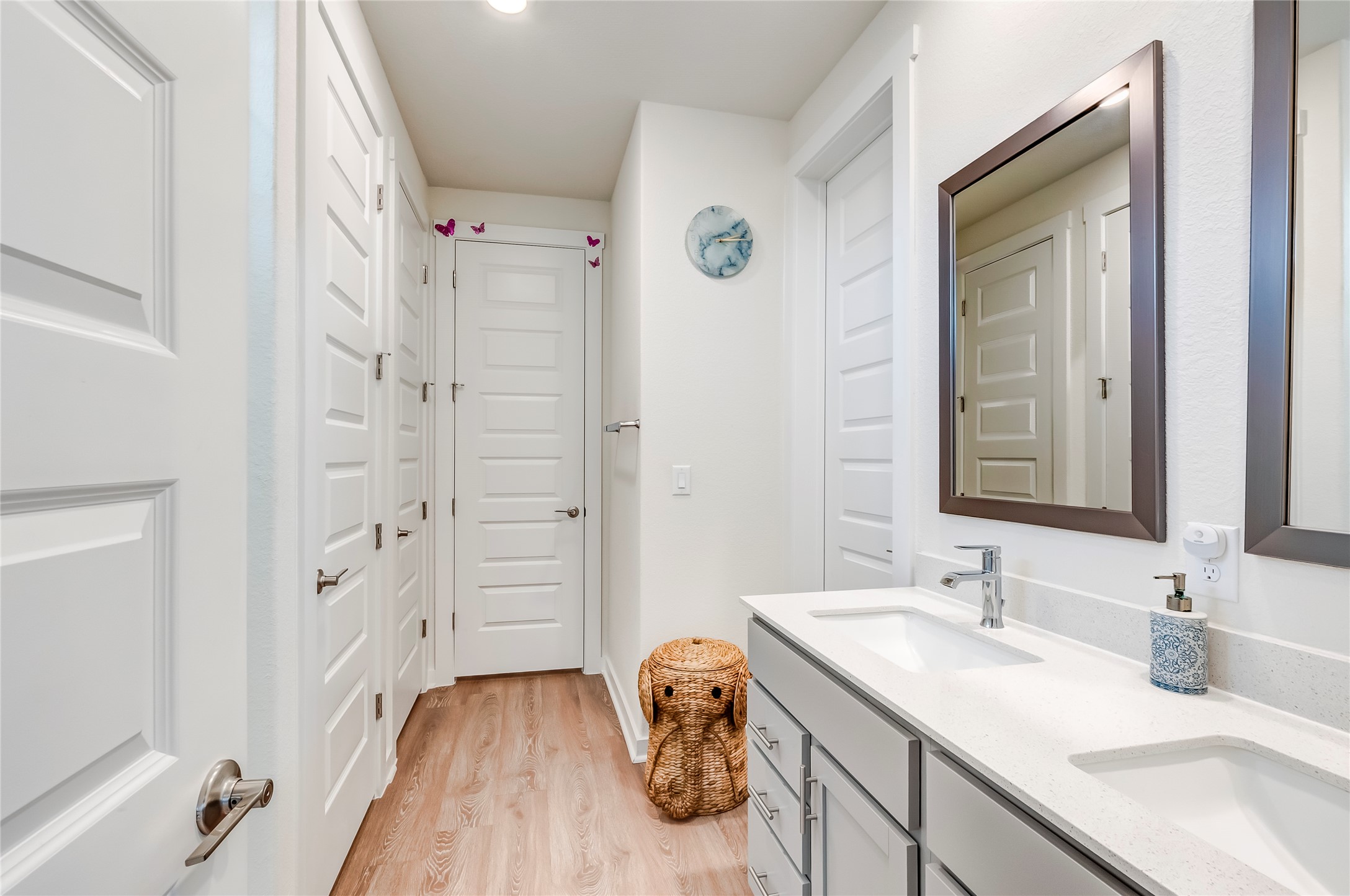 917 Balsora Cove Georgetown, TX 78628 - Photo 22 of 39 Full bathroom featuring double vanity and light wood-type flooring
