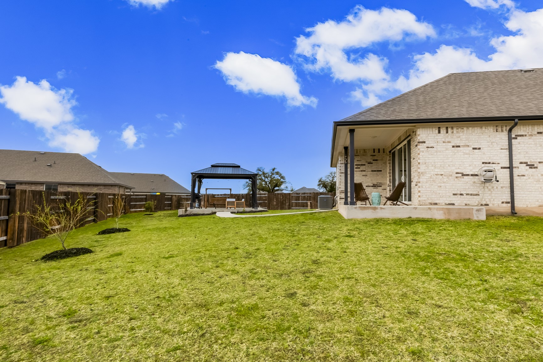 917 Balsora Cove Georgetown, TX 78628 - Photo 37 of 39 Fenced backyard featuring a patio and a gazebo