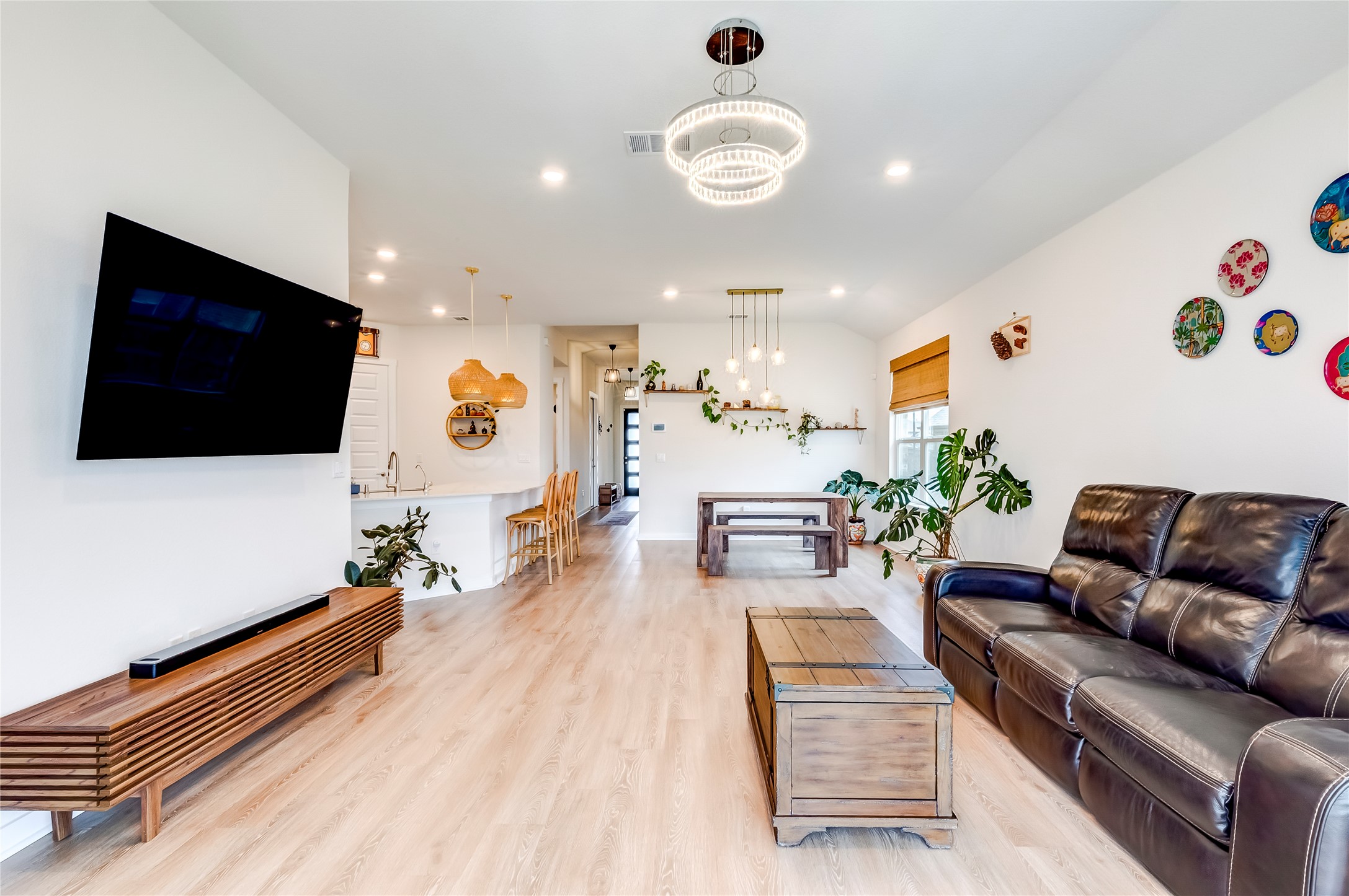 917 Balsora Cove Georgetown, TX 78628 - Photo 8 of 39 Living room with light wood-style floors and suspended lighting