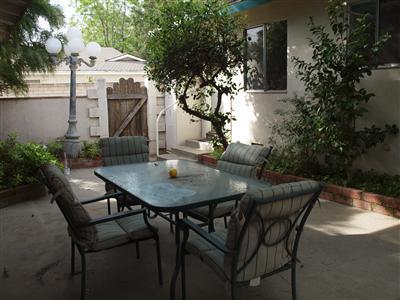 780 South Rice Road Ojai, CA 93023 - Photo 15 of 20 a view of a patio with table and chairs and potted plants