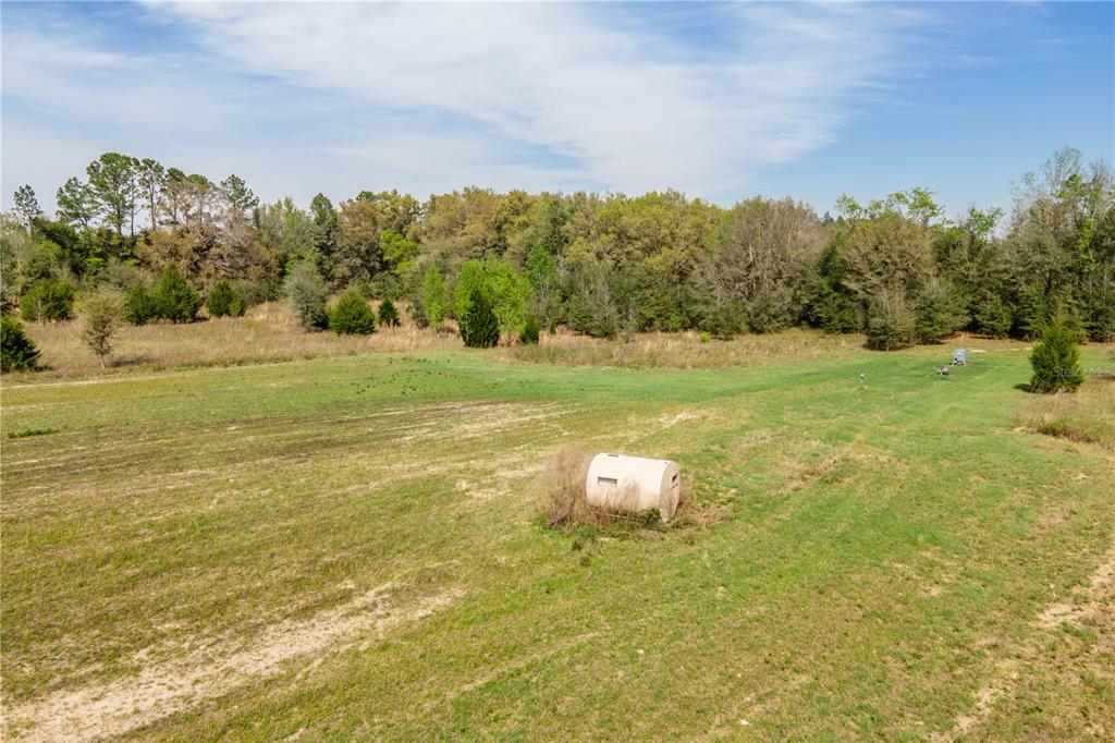 Tbd Southwest 298th Street Newberry, FL 32669 - Photo 14 of 18 a view of a big yard with an outdoor space