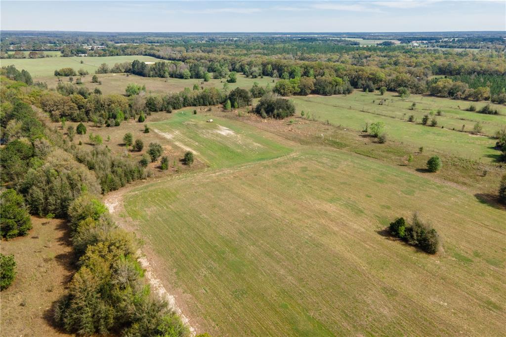 Tbd Southwest 298th Street Newberry, FL 32669 - Photo 8 of 18 a view of a field with an ocean