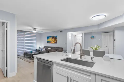 a kitchen with a sink and a stove top oven