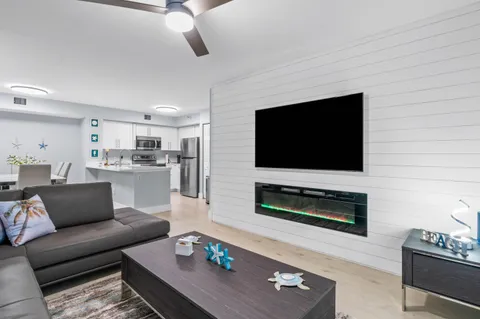 a living room with furniture and a flat screen tv