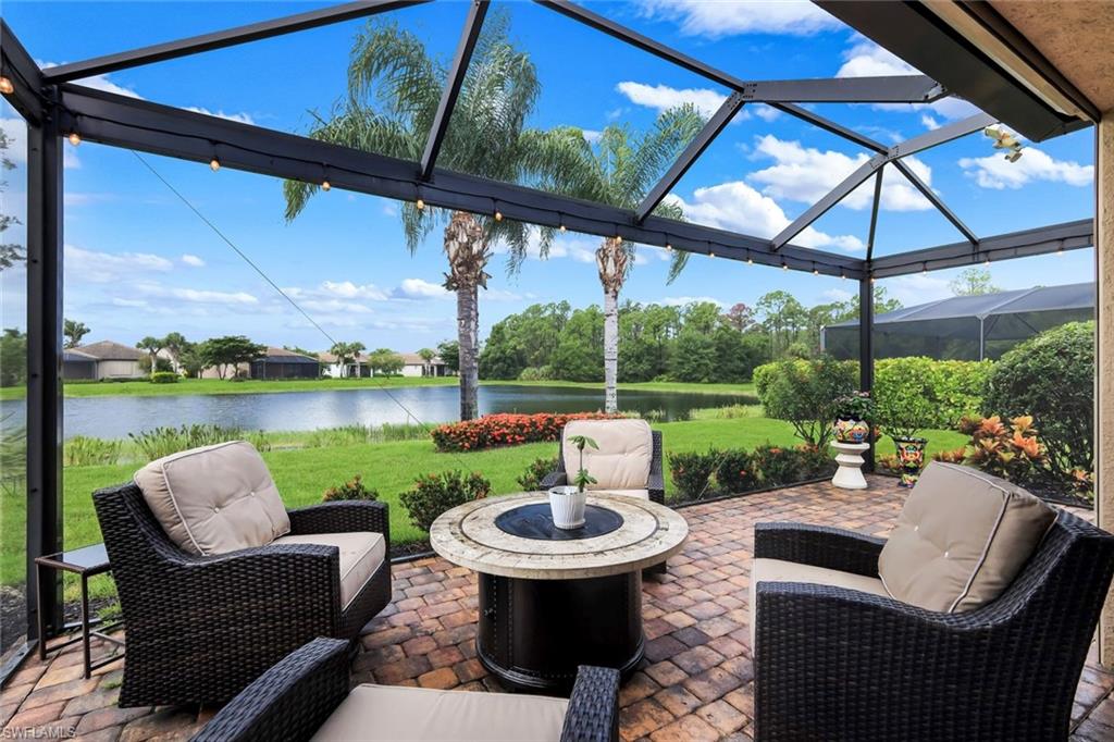 10820 Rutherford Road Fort Myers, FL 33913 - Photo 21 of 42 Screened lanai featuring a paver patio and string lighting