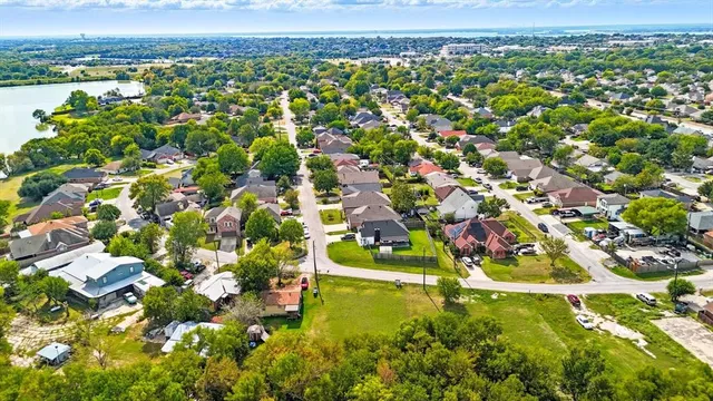 an aerial view of residential houses with outdoor space