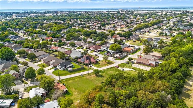 an aerial view of residential house with outdoor space and parking