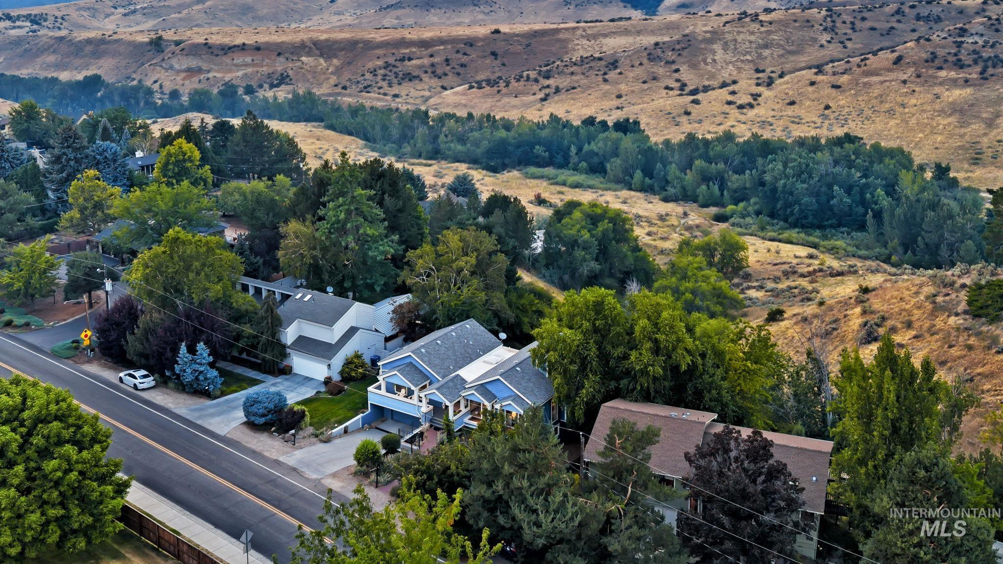 1750 East Shaw Mountain Road Boise, ID 83712 - Photo 42 of 47 Blue multi-story residence featuring a front balcony and an attached garage