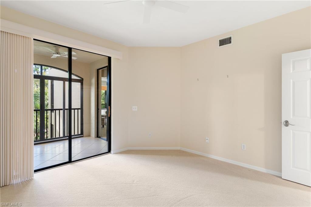 6500 Valen Way, Unit A203 Naples, FL 34108 - Photo 17 of 28 an empty room with windows and closet