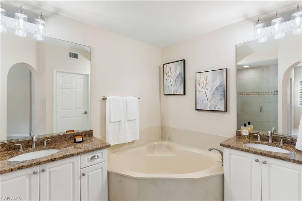 6500 Valen Way, Unit A203 Naples, FL 34108 - Photo 20 of 28 a bathroom with a granite countertop sink double and mirror