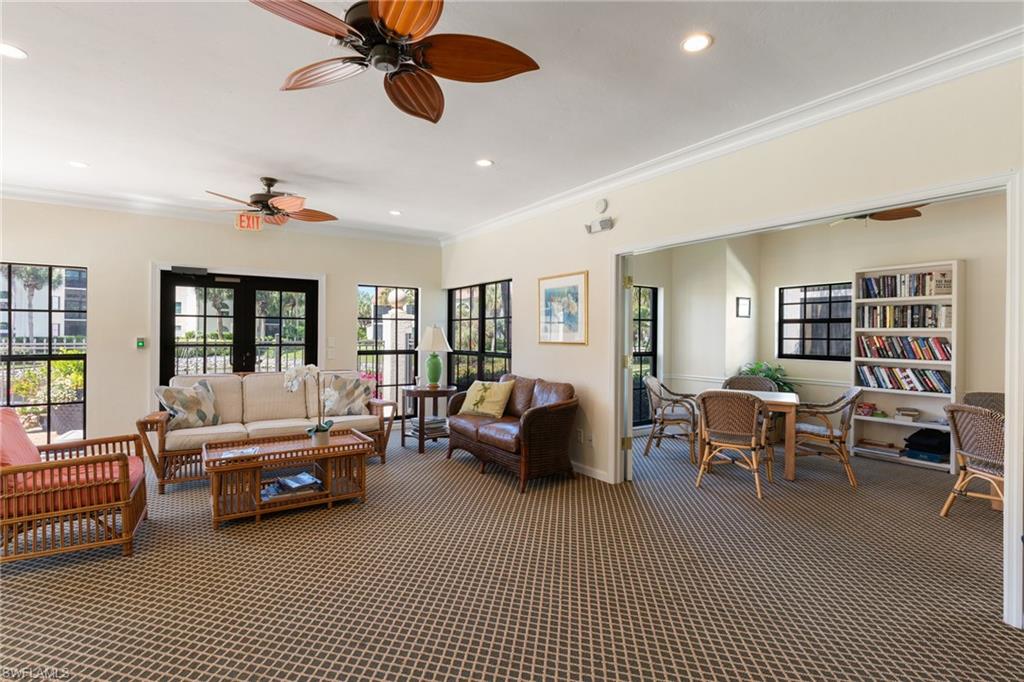 6500 Valen Way, Unit A203 Naples, FL 34108 - Photo 27 of 28 a living room with furniture and a window