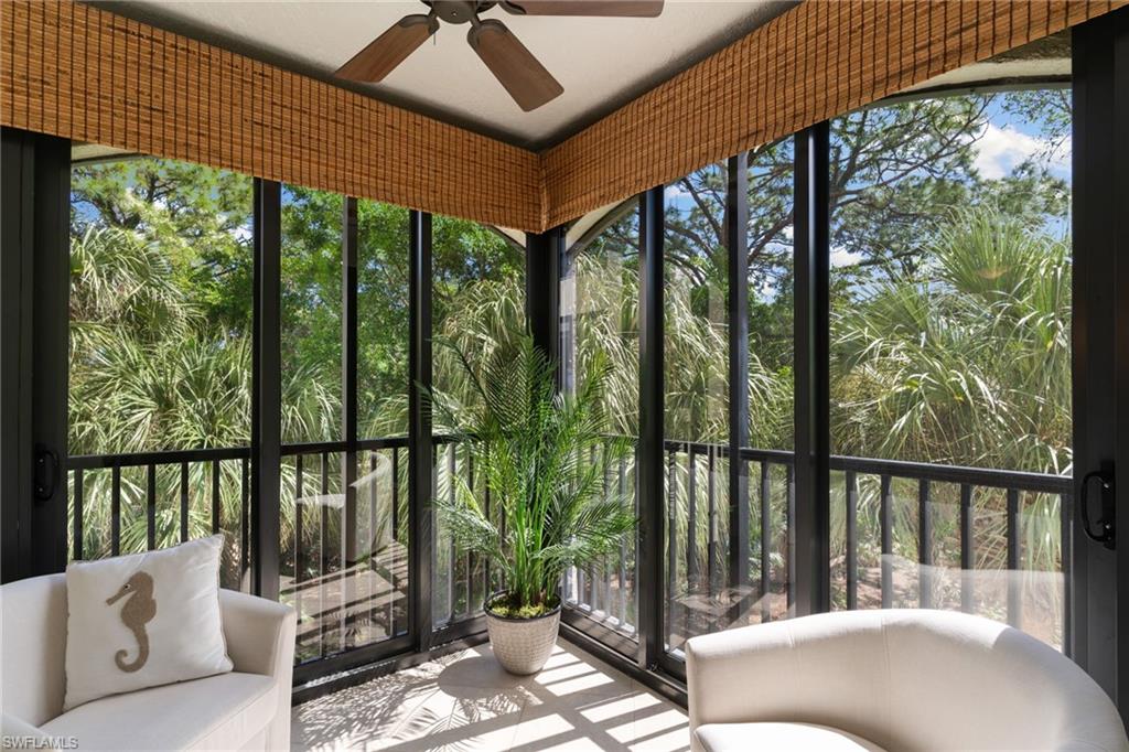 6500 Valen Way, Unit A203 Naples, FL 34108 - Photo 9 of 28 a balcony with furniture