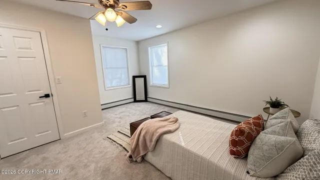 a bed room with a bed and a dresser