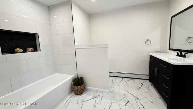 a living room with furniture and a rug