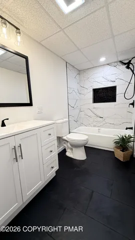 a living room with furniture and a rug