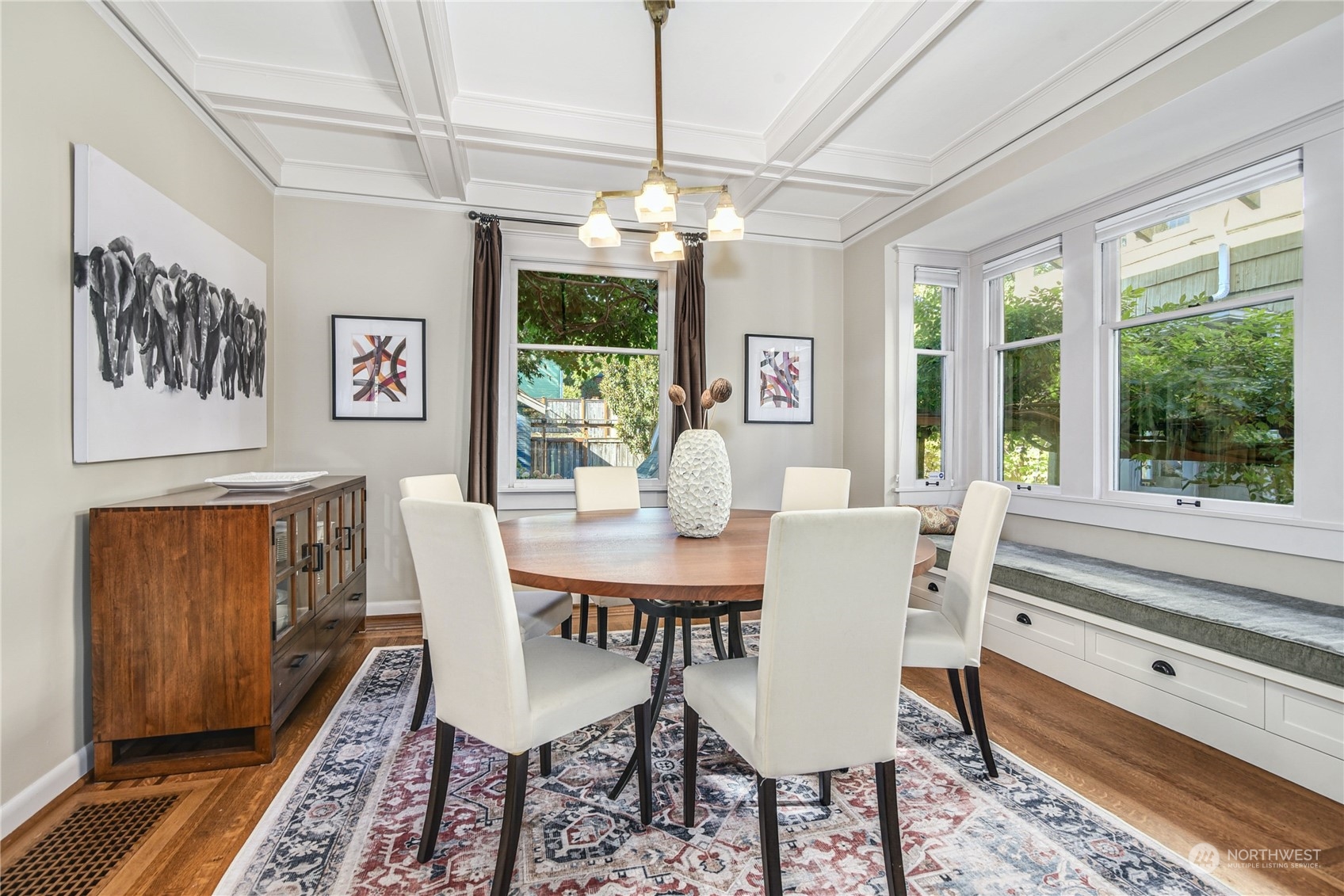 1249 18th Avenue East Seattle, WA 98112 - Photo 11 of 39 a dining room with furniture a chandelier and wooden floor