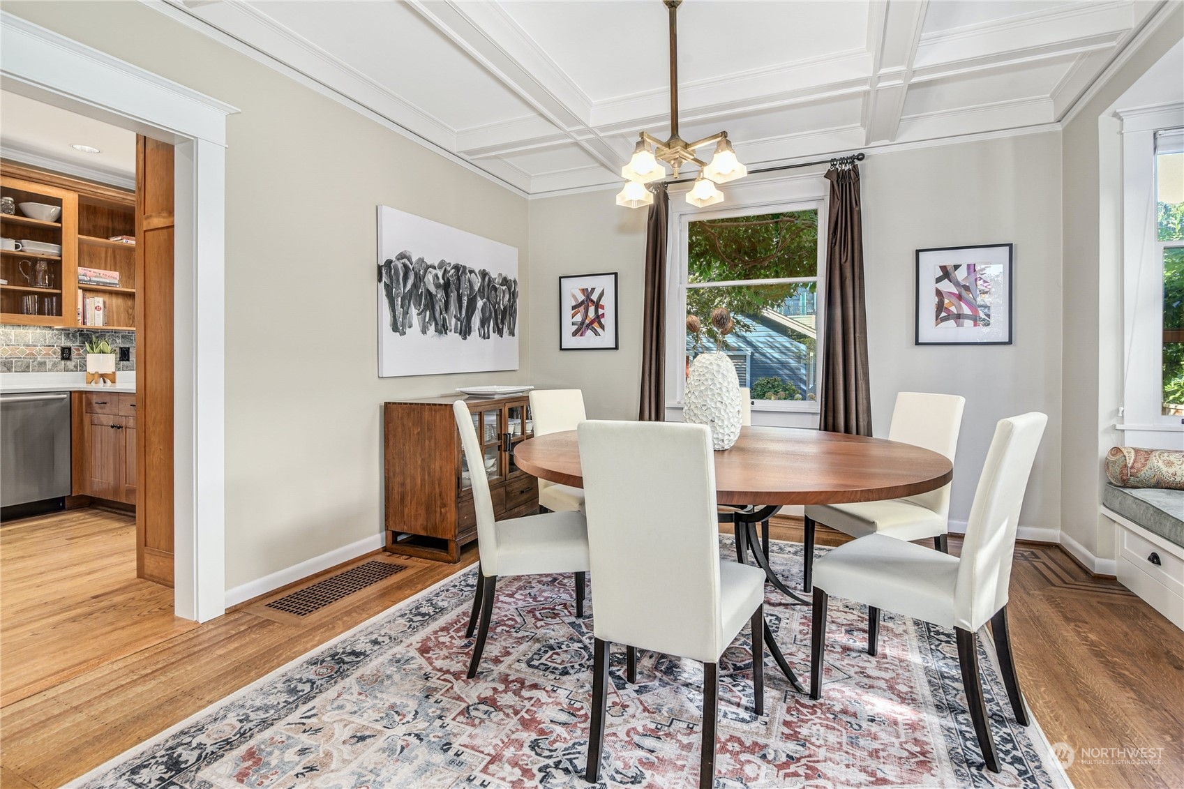 1249 18th Avenue East Seattle, WA 98112 - Photo 12 of 39 a view of a dining room with furniture window and wooden floor