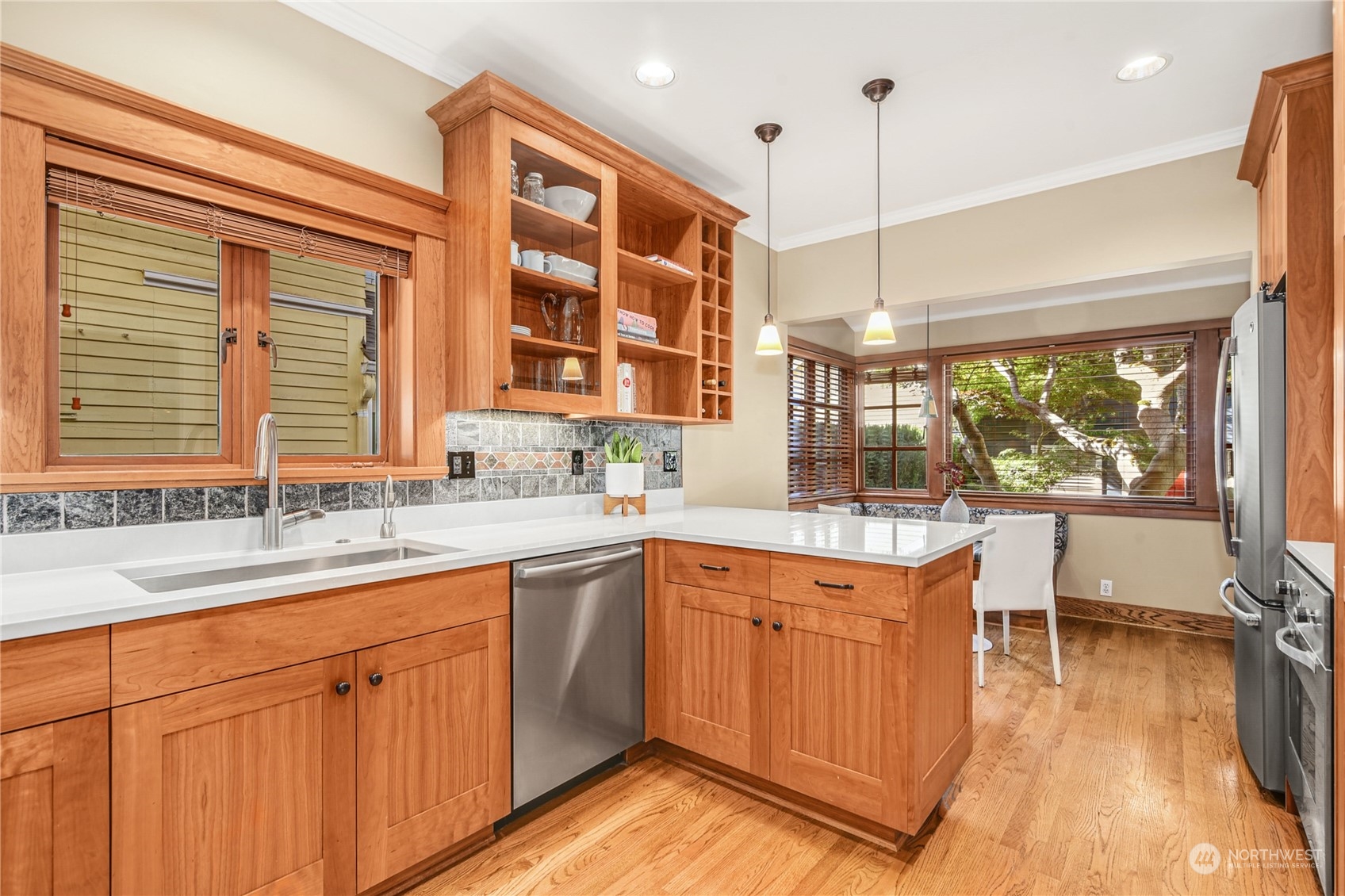 1249 18th Avenue East Seattle, WA 98112 - Photo 16 of 39 a kitchen with a sink and large windows