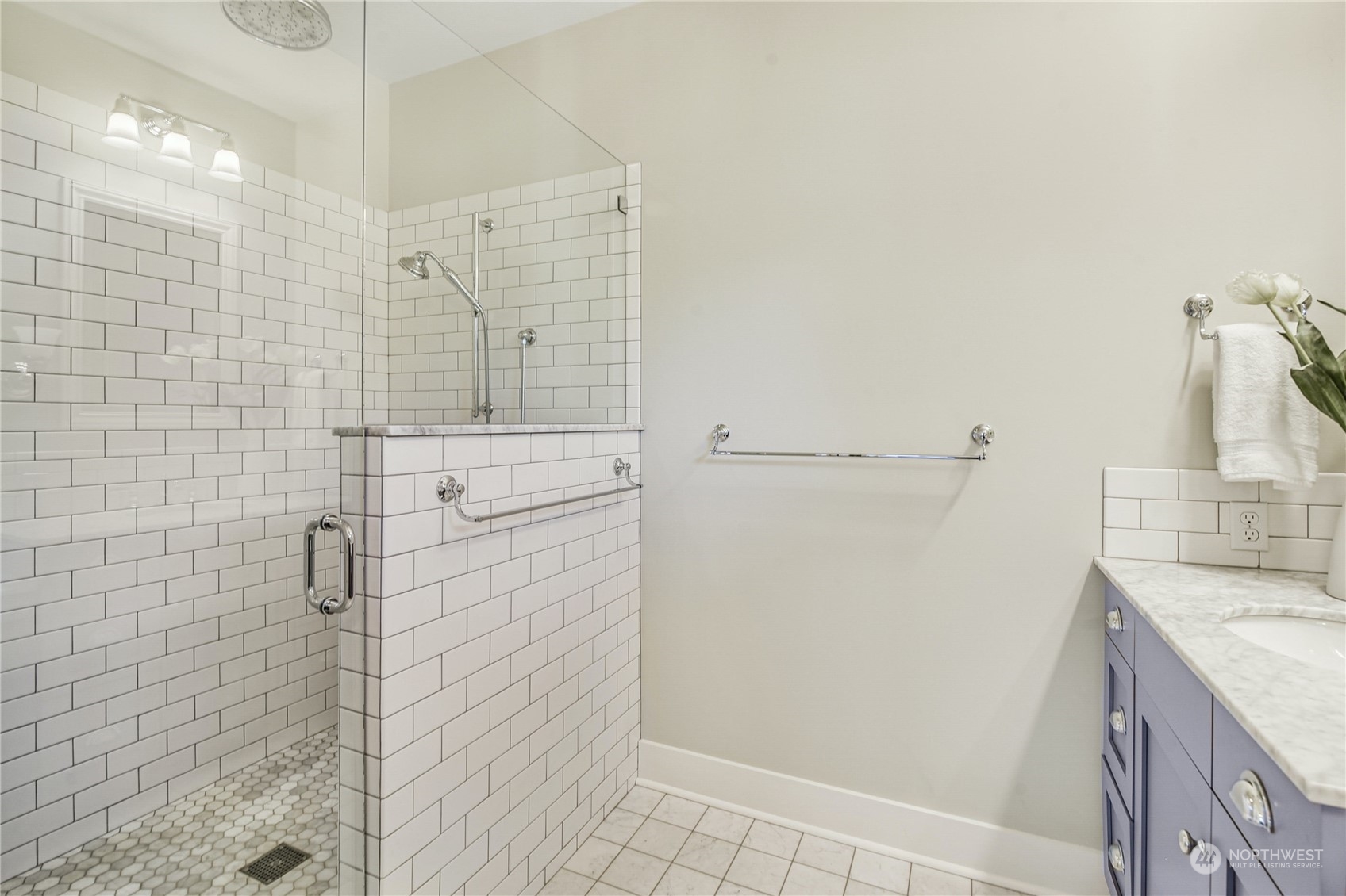 1249 18th Avenue East Seattle, WA 98112 - Photo 22 of 39 a bathroom with a granite countertop shower