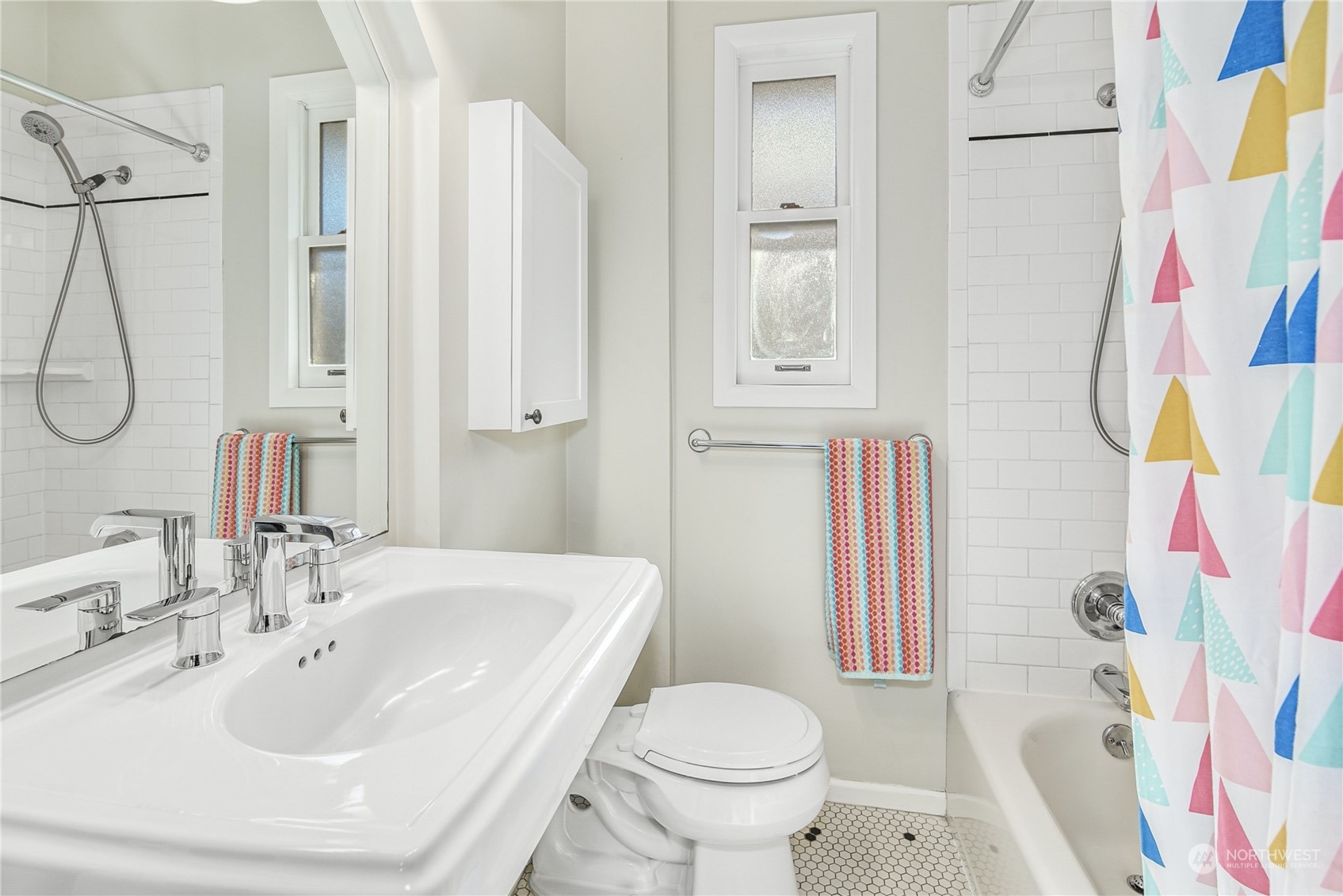 1249 18th Avenue East Seattle, WA 98112 - Photo 27 of 39 a bathroom with a sink toilet and shower