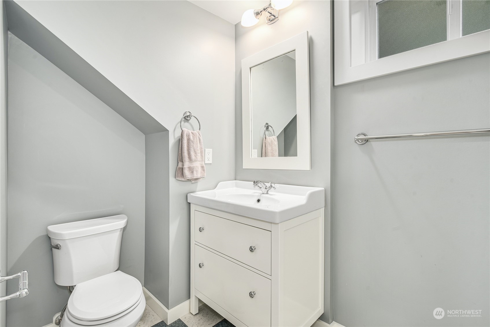 1249 18th Avenue East Seattle, WA 98112 - Photo 32 of 39 a bathroom with a toilet a sink and mirror