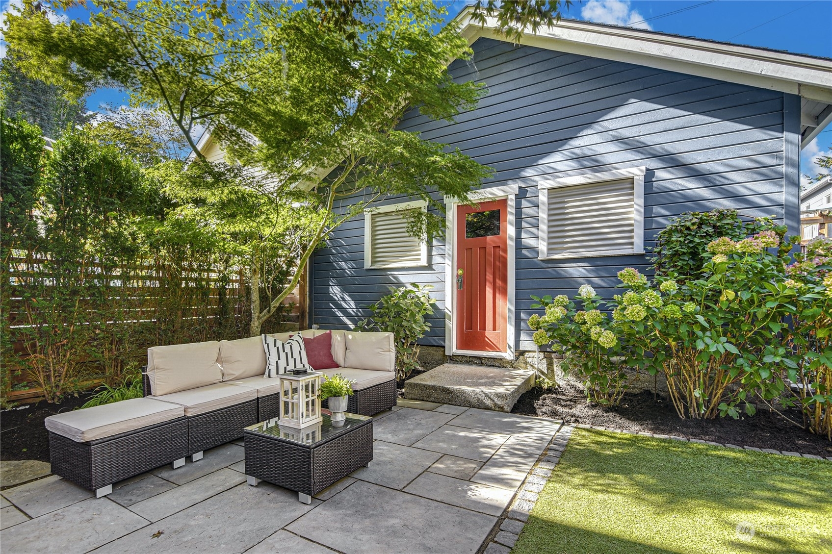 1249 18th Avenue East Seattle, WA 98112 - Photo 37 of 39 a view of a patio with couches table and chairs and potted plants