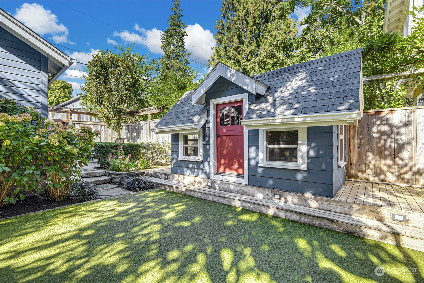 1249 18th Avenue East Seattle, WA 98112 - Photo 38 of 39 a front view of house with yard and outdoor seating