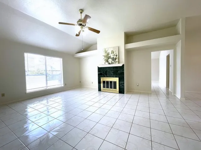 a view of an empty room with a window