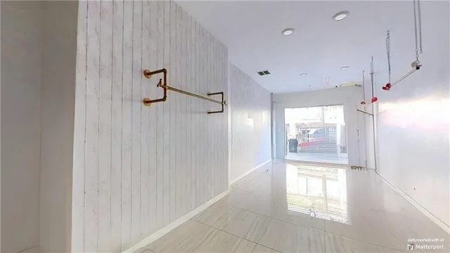 a utility room with lots of wooden furniture