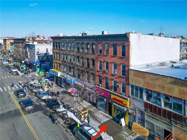 a view of hallway with wooden floor