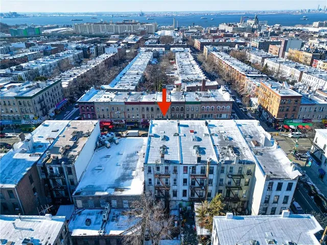 a bathroom with a glass shower door and a window