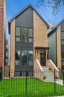 a front view of a house with glass windows