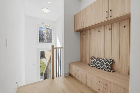 a view of wooden closet and windows