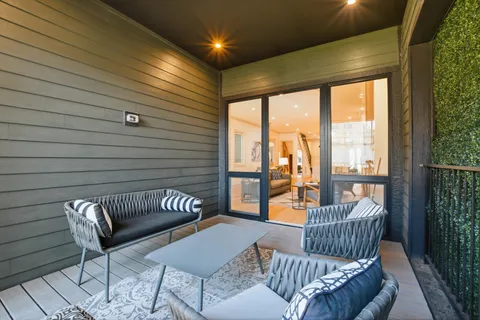 a balcony with furniture and a couch