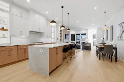 a kitchen with a sink appliances and cabinets