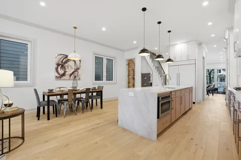 a kitchen with stainless steel appliances granite countertop a stove oven and a refrigerator