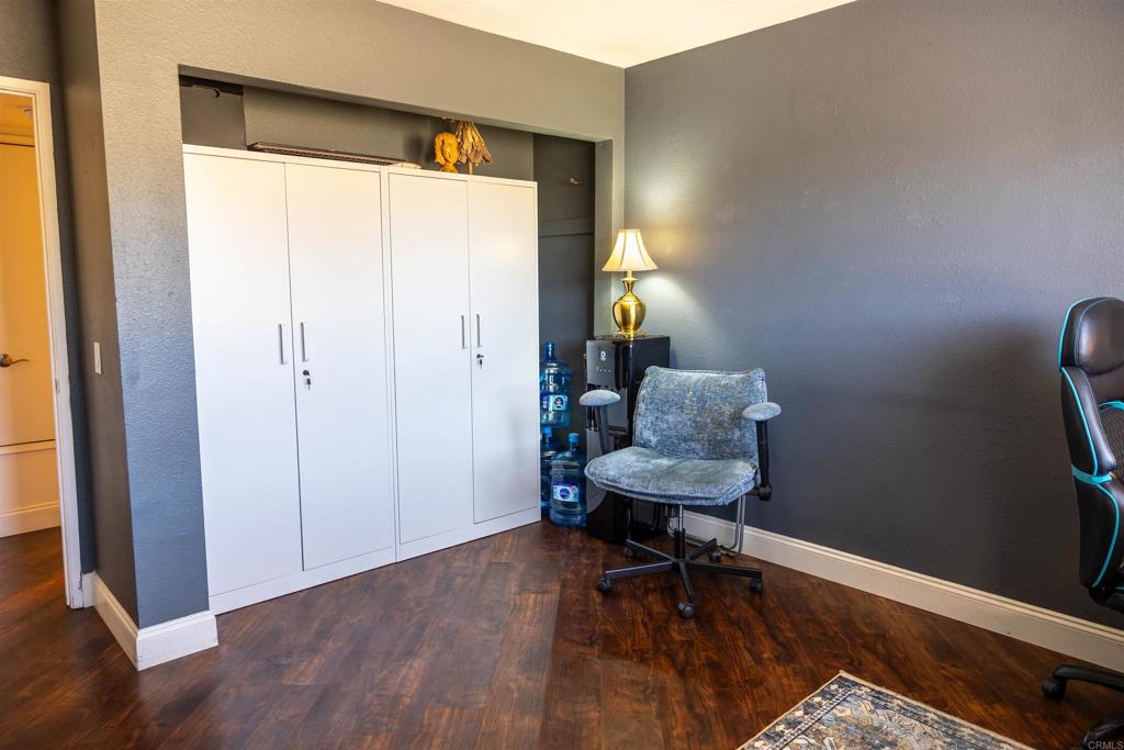 2910 Elm Tree Court Spring Valley, CA 91978 - Photo 12 of 27 a view of a workspace with furniture and a window